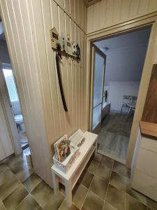 a room with a white table and a mirror at Apartman Ilike in Balatonfüred +25 photos