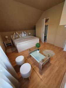 a large bedroom with a bed and a table at Apartman Ilike in Balatonfüred