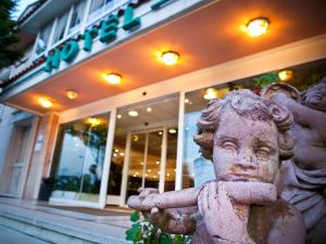 a statue of a little boy with his arms crossed at Hotel Begoña Park in Gijón