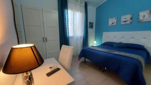 Ein Bett oder Betten in einem Zimmer der Unterkunft La Suite Di Segesta