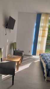 TV a/nebo společenská místnost v ubytování Sofial Guesthouse