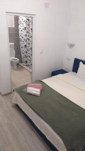 Postel nebo postele na pokoji v ubytování Sofial Guesthouse