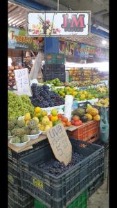 a produce section of a market with fruits and vegetables at Guest Apartment Paulo in Recife