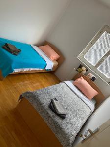 Postel nebo postele na pokoji v ubytování Apartman centar