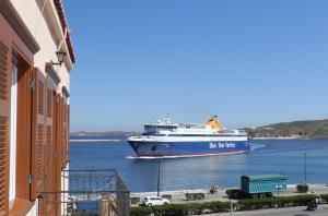 a large ship in a large body of water at Ostria in Ermoupoli