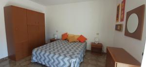 En eller flere senge i et værelse på Villa Maria