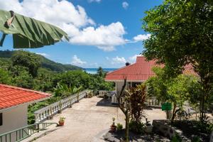 a resort with a view of the ocean at Janes' Serenity Guesthouse in Anse a La Mouche