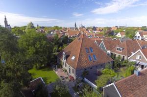 an overhead view of a village with houses and trees at Dream Boutique Edam Bed & Coffee in Edam +28 photos