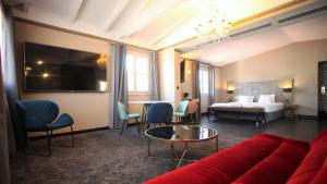 Rúm í herbergi á Hotel POZZO DI BORGO