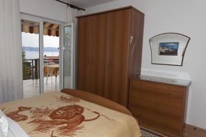 Łóżko lub łóżka w pokoju w obiekcie Rooms Raos