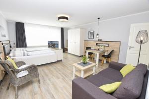 En eller flere senge i et værelse på Appartement Rehn Büsum