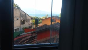 a view of a city from a window at Mi casa Su casa Lofts - LOFT 5 in Angra dos Reis