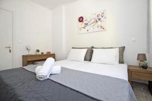 Кровать или кровати в номере Vidos Seaview Suite