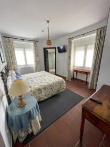 Postel nebo postele na pokoji v ubytování Hotel Los Caspios