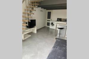 Kuchyň nebo kuchyňský kout v ubytování Joli studio avec terrasse privée