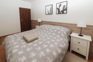 A bed or beds in a room at Vila Olívia - Apartmán Olívia 1