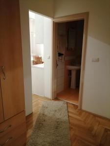 a bathroom with a sink and a toilet in a room at Jaca 2 in Požarevac