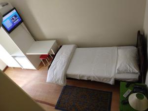 Postel nebo postele na pokoji v ubytování Hotel Cervantes