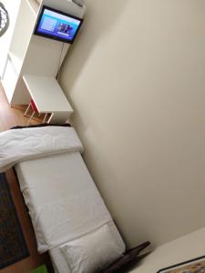 Postel nebo postele na pokoji v ubytování Hotel Cervantes