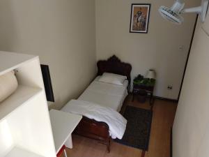Postel nebo postele na pokoji v ubytování Hotel Cervantes