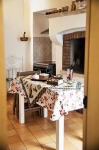 a kitchen with a table with a table cloth on it at Morgana in Casarano +27 photos