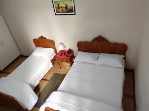 Postel nebo postele na pokoji v ubytování Hotel Cervantes
