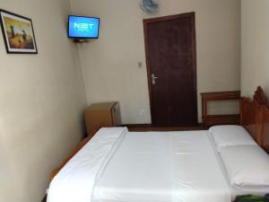 Postel nebo postele na pokoji v ubytování Hotel Cervantes