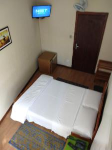 Postel nebo postele na pokoji v ubytování Hotel Cervantes