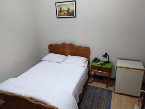Postel nebo postele na pokoji v ubytování Hotel Cervantes