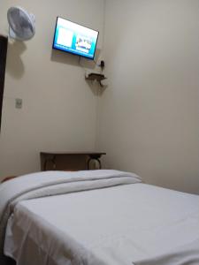 Postel nebo postele na pokoji v ubytování Hotel Cervantes