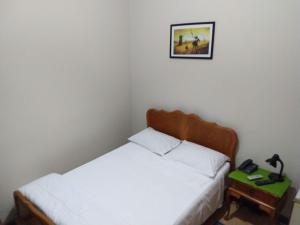 Postel nebo postele na pokoji v ubytování Hotel Cervantes