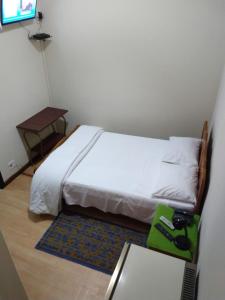 Postel nebo postele na pokoji v ubytování Hotel Cervantes