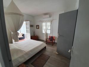Postel nebo postele na pokoji v ubytování VILLA LES GRIVES