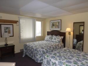 Кровать или кровати в номере Footbridge North Hotel