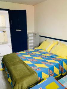 Ένα ή περισσότερα κρεβάτια σε δωμάτιο στο Cantinho dos Amigos