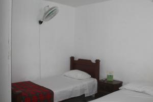 Postel nebo postele na pokoji v ubytování Hospedaje Primavera