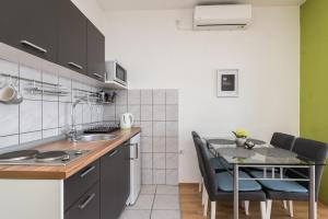 Kuchyň nebo kuchyňský kout v ubytování Apartments Marko Dominik