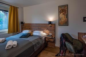 A bed or beds in a room at Eger Castle Hill Premium Apartments