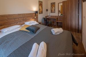A bed or beds in a room at Eger Castle Hill Premium Apartments