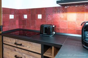A kitchen or kitchenette at Eger Castle Hill Premium Apartments