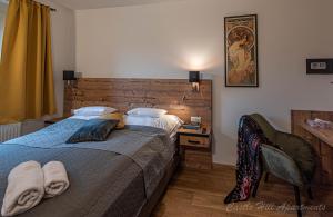 A bed or beds in a room at Eger Castle Hill Premium Apartments