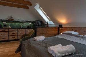 A bed or beds in a room at Eger Castle Hill Premium Apartments