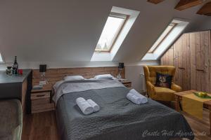 A bed or beds in a room at Eger Castle Hill Premium Apartments