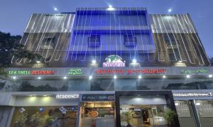 a building with a sign that reads subway restaurant at Treebo Savoury Sea Shell Residency in Bengaluru