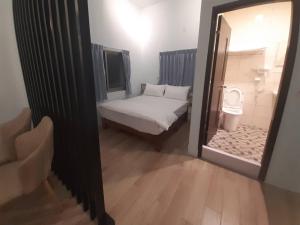 Postel nebo postele na pokoji v ubytování Yueli Homestay