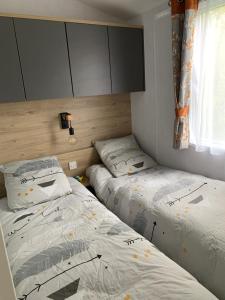 מיטה או מיטות בחדר ב-Rêverie d’été