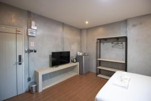 Rabbit Hotel Phimai客房内的一张或多张床位
