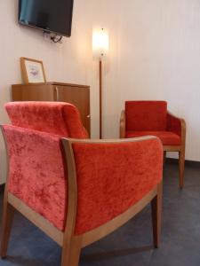 Posezení v ubytování Cit'Hotel de La Vallée