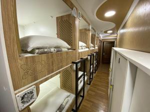 a row of bunk beds in an rv at BUDGET HOTEL and HOSTEL in Tashkent