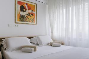 Un pat sau paturi într-o cameră la Apartments Zagreb West